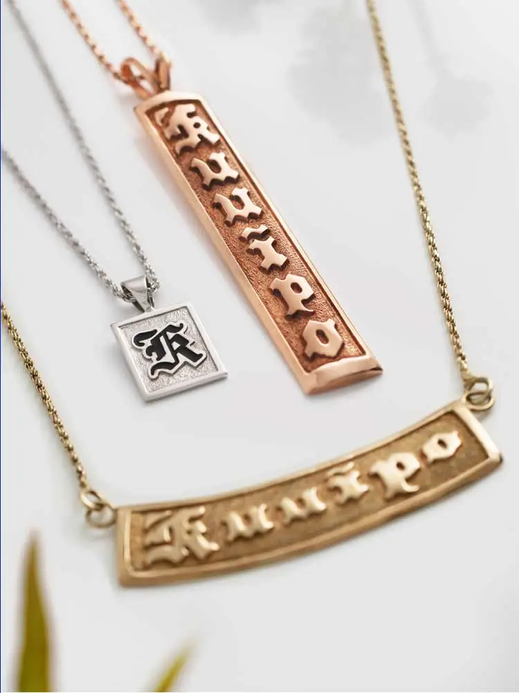 A mix of our Hawaiian pendant offerings. Includes our horizontal Hawaiian necklace in 14K gold, with a rose gold Hawaiian vertical pendant and white gold initial pendant.